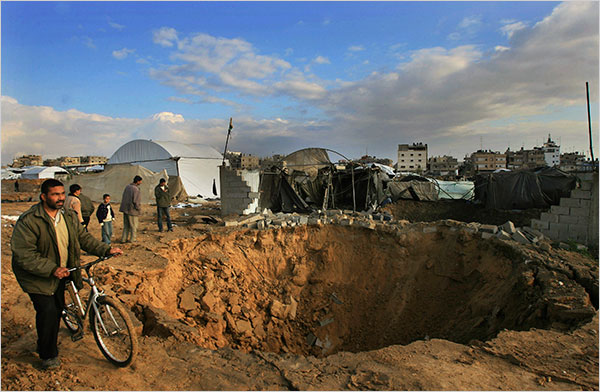 On the fifth day of Israels massive attack on Hamas sites throughout Gaza in retaliation for the recent rocket fire from the area, Palestinians examin bombed tunnels, which provided crucial supply lines along Gaza's border with Egypt, December 31, 2008.