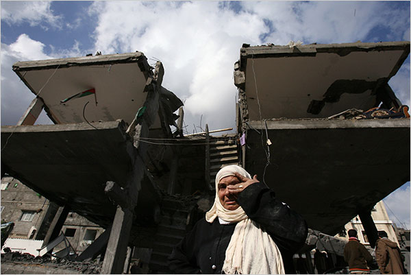 On the fifth day of Israel’s massive attack on Hamas sites throughout Gaza in retaliation for the recent rocket fire from the area, a woman weeps in front of her destroyed house in the Jabalia refugee camp, December 31, 2008.