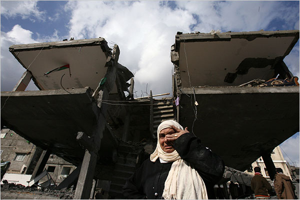 On the fifth day of Israels massive attack on Hamas sites throughout Gaza in retaliation for the recent rocket fire from the area, a woman weeps in front of her destroyed house in the Jabalia refugee camp, December 31, 2008.
