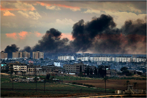 On the seventh day of Israels massive attack on Hamas sites throughout Gaza in retaliation for the recent rocket fire from the area, Palestinians collect belongings from the destroyed home of killed Hamas leader Nizar Rayyan, January 2, 2009.