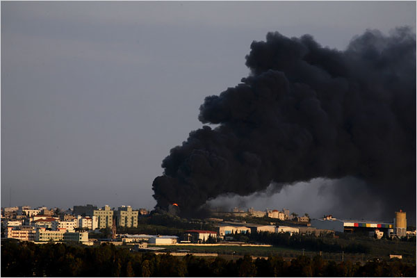 On the ninth day of Israels war against Gaza, a fire rages at a Gaza gas plant that had been hit by an Israeli shell, January 4, 2009.