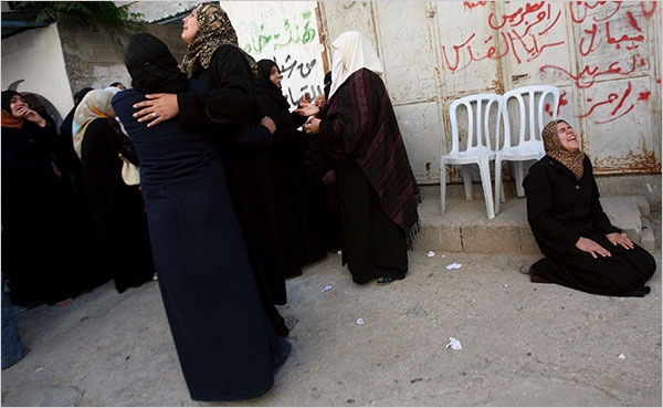 On the twelfth day of Israel’s war against Gaza, women grieve during a funeral for ten family members killed in a missile strike, January 7, 2009.