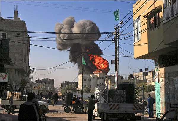 On the seventeenth day of Israels war against Gaza, smoke and fire rise from fuel tanks hit by an Israeli airstrike in Rafah, Gaza Strip, January 12, 2009.