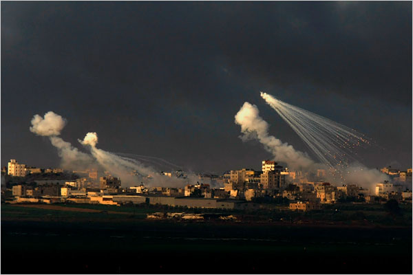 On the seventeenth day of Israels war against Gaza, smoke billows from Israeli artillery shells exploding over northern Gaza, January 12, 2009.