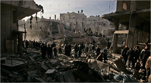 On the nineteenth day of Israel’s war against Gaza, Palestinians inspect a section of Gaza City after an Israeli attack, January 14, 2009.