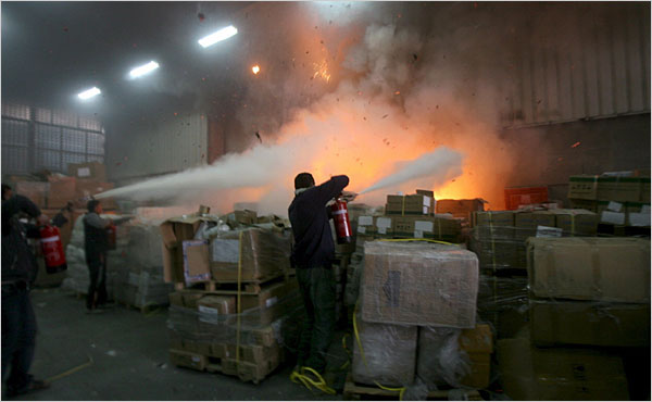 On the twentieth day of Israel’s war against Gaza, workers fight a fire at a United Nations building which was among those hit during Israeli shelling, Gaza City, January 15, 2009.
