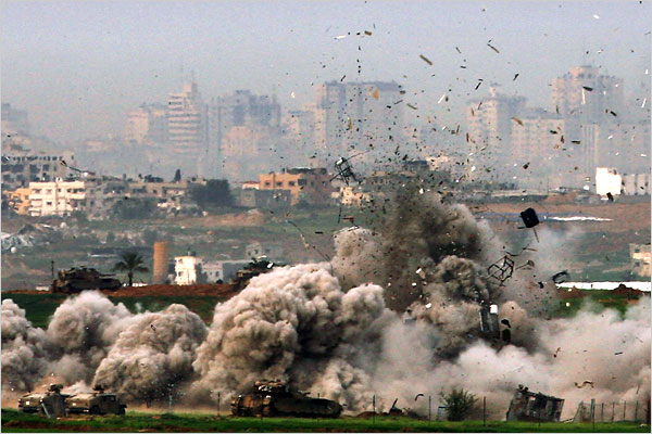 On the tweny-first day of Israels war against Gaza, Israeli tanks destroy a house in Gaza, an act seen from the Israeli side of the border, January 16, 2009.