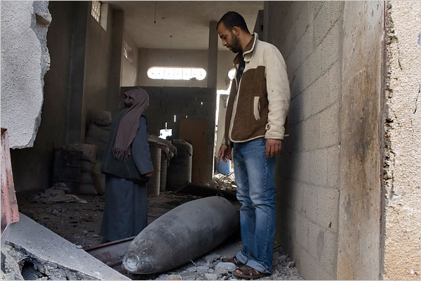 On the tweny-first day of Israels war against Gaza, a large bomb fragment land on the room of a Palestinian man after exploding on a suspected tunnel house along the Philadelphi corridor in the southern city of Rafah, Gaza, January 16, 2009.
