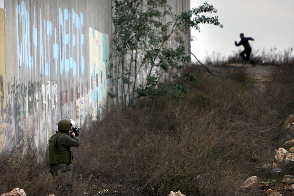 On the tweny-first day of Israels war against Gaza, young Palestinians clash with Israeli security forces in the West Bank, January 16, 2009.