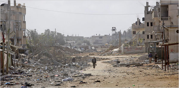 On the twenty-second day of Israels war against Gaza, a Palestinian walks in a damaged street, Rafah, January 17, 2009.