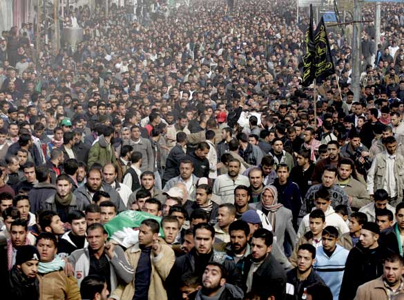 Palestinian mourners follow the body of top Hamas official Saeed Seyyam, killed the day before in an Israeli airstrike, Gaza City, January 16, 2009.