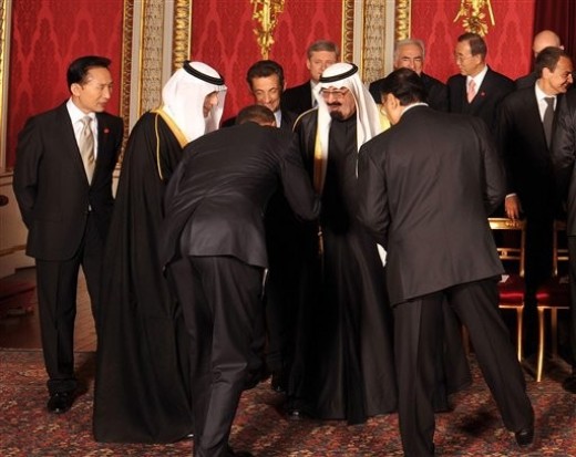 In front of World leaders of G20 summit, the so-called U.S. President Barack Hussein Obama, dives for almost 180 degrees to kiss the hand of Saudi King Abdullah, on arriving for a family photograph at the G20 summit at the ExCel centre, east London, April 2, 2009.