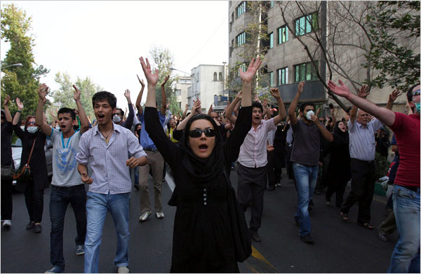 Emboldened by both their larger-than-expected numbers and the support from citizens on the streets, thousands of demonstrators chant 'death to the dictator' and confront tear gas fired by riot-police, as they mass to mark the 10th anniversary of Basij massacre at Tehran University, and to commemorate the protesters who were killed in the turmoil after the corrupt and invalid June 12 election, Tehran, July 9, 2009.