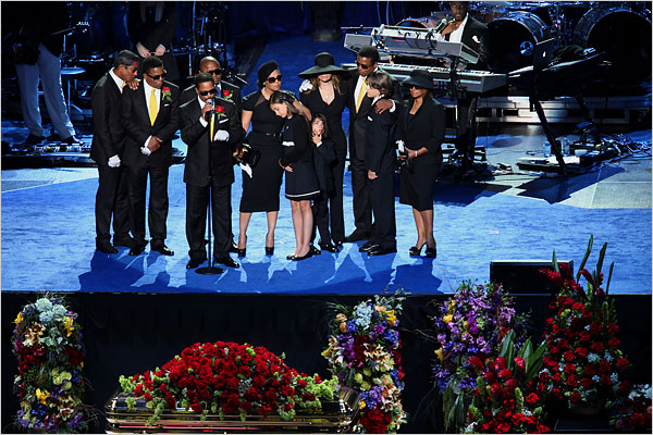 Paris Jackson, Michael Jackson's 11-year-old daughter, center, takes the stage with Jackson's children and family at the end of the memorial service, July 7, 2009.