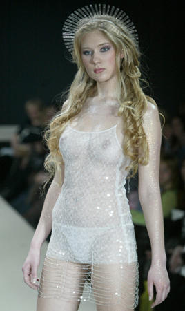 A model presents a creation by Russian designer Ianis Chamalidy, a part of the fashion show 'Defile na Neve,' St. Petersburg, April 1, 2004.