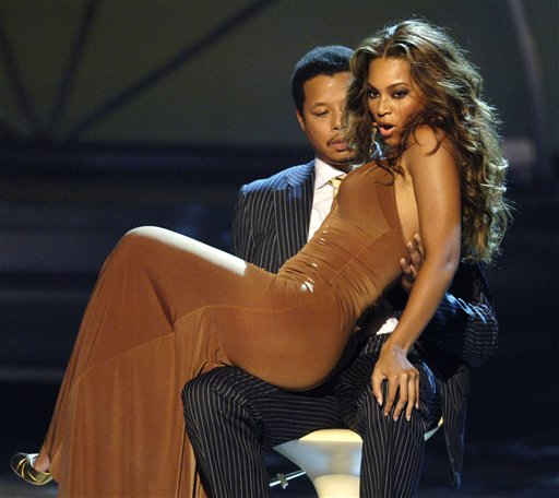 Beyonce dances on actor Terrance Howard's lap as Destiny's Child performs during the 5th annual BET Awards, Los Angeles, June 28, 2005.