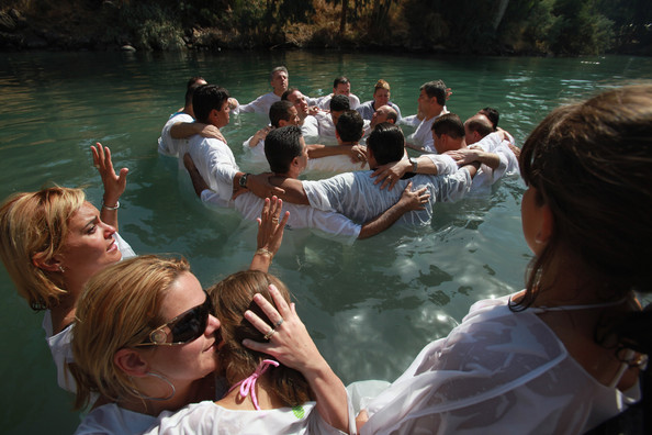 Brazilian Evangelist Christians embrace in prayer during their mass baptism ceremony in the Jordan River, Yardenit, northern Israel, October 4, 2009.