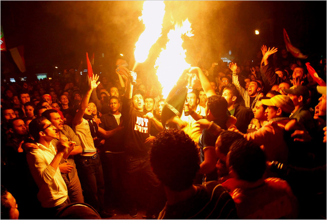 Protesting violence against Egyptian soccer fans in Khartoum after the special play-off match for the 2010 World Cup the day before, Egyptians demonstrate near the Algerian Embassy, Cairo, Egypt, late night, November 19, 2009.