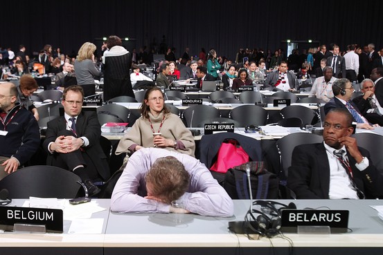 A delegate sleeps during an all-night plenary meeting at the U.N. Climate Change Conference, Copenhagen, December 19, 2009.