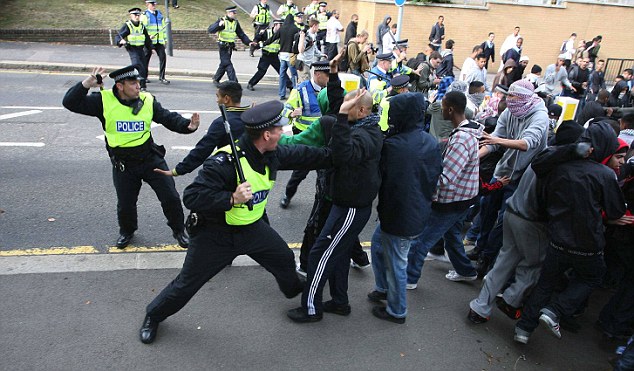 Anti-right wing youths and English Defence League clash with police at rally outside Harrow mosque, London, September 11, 2009.
