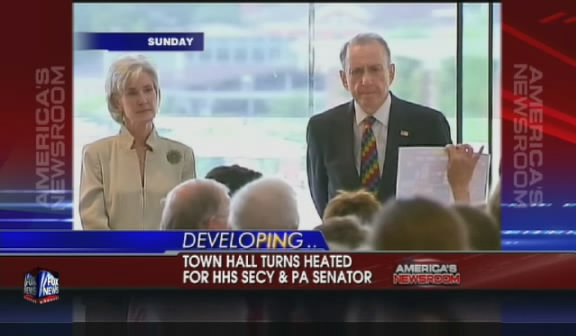 Audience shouts down Health and Human Services Secretary Kathleen Sebelius and Senator Arlen Specter at health care town hall, Philadelphia, August 2, 2009.