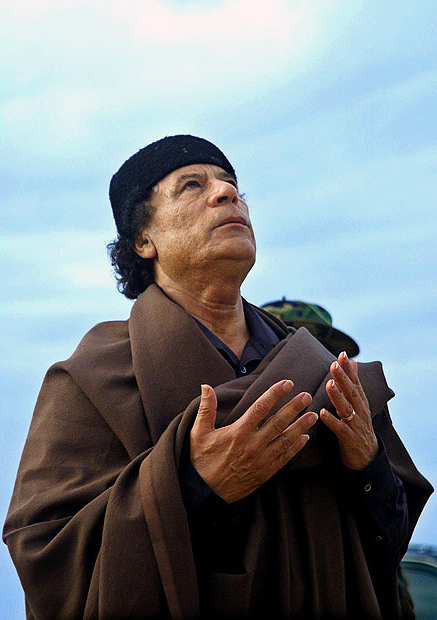 Libyan leader Muammar Al-Qaddafi performs a prayer inside Gurdabiya Dam after the opening ceremony of the dam which is a phase of Libya's 'Great Man-Made River' water project, the 40th anniversary of Qadhafi coup, September 1, 2009.