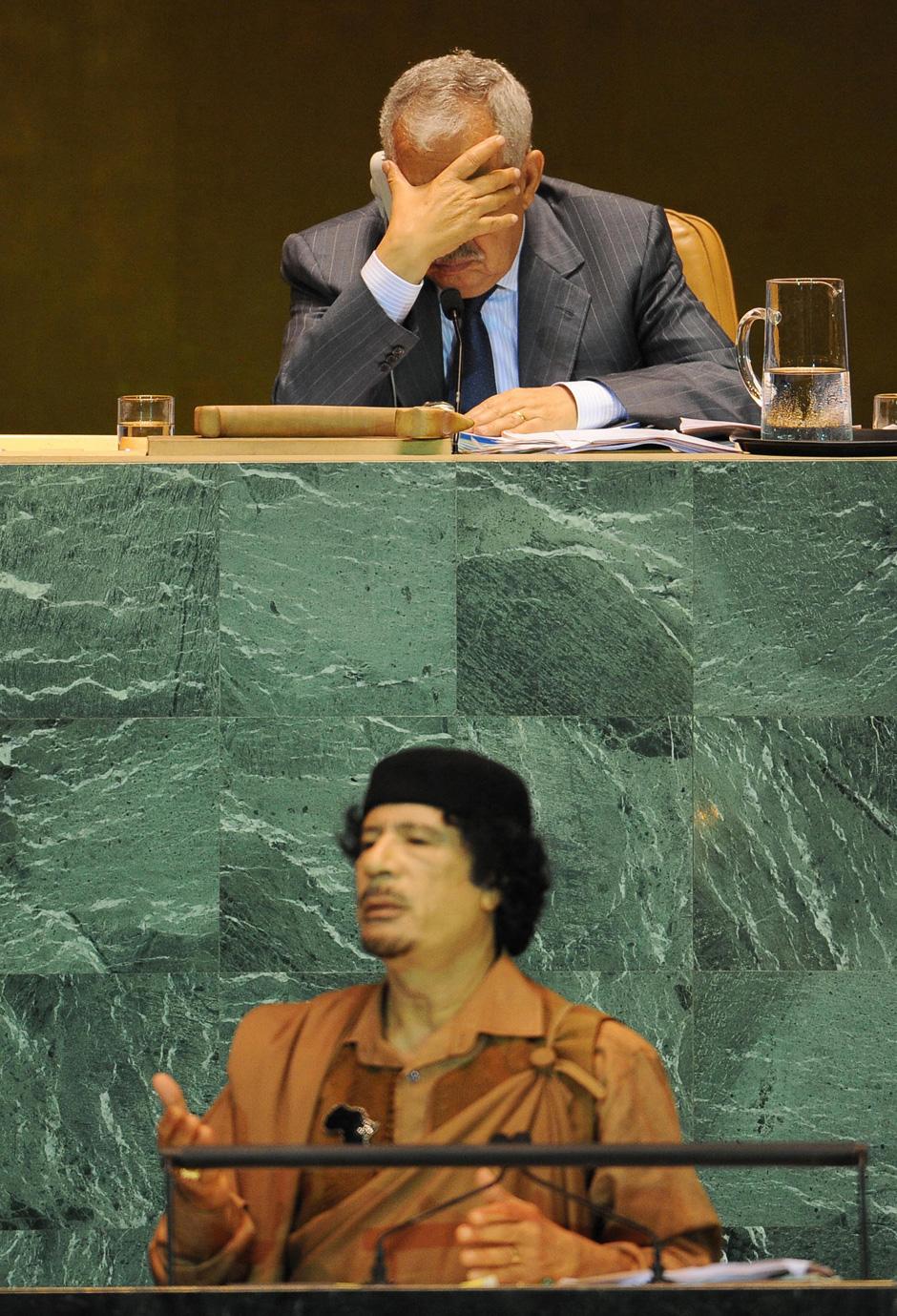 Al-Buraq Hussein Abu-Ommo and Libyan leader Muammar Al-Qaddafi speaks at the UN General Assembly, as the Assembly president, Ali Abdus-Salam At-Treki naps, New York, September 23, 2009.