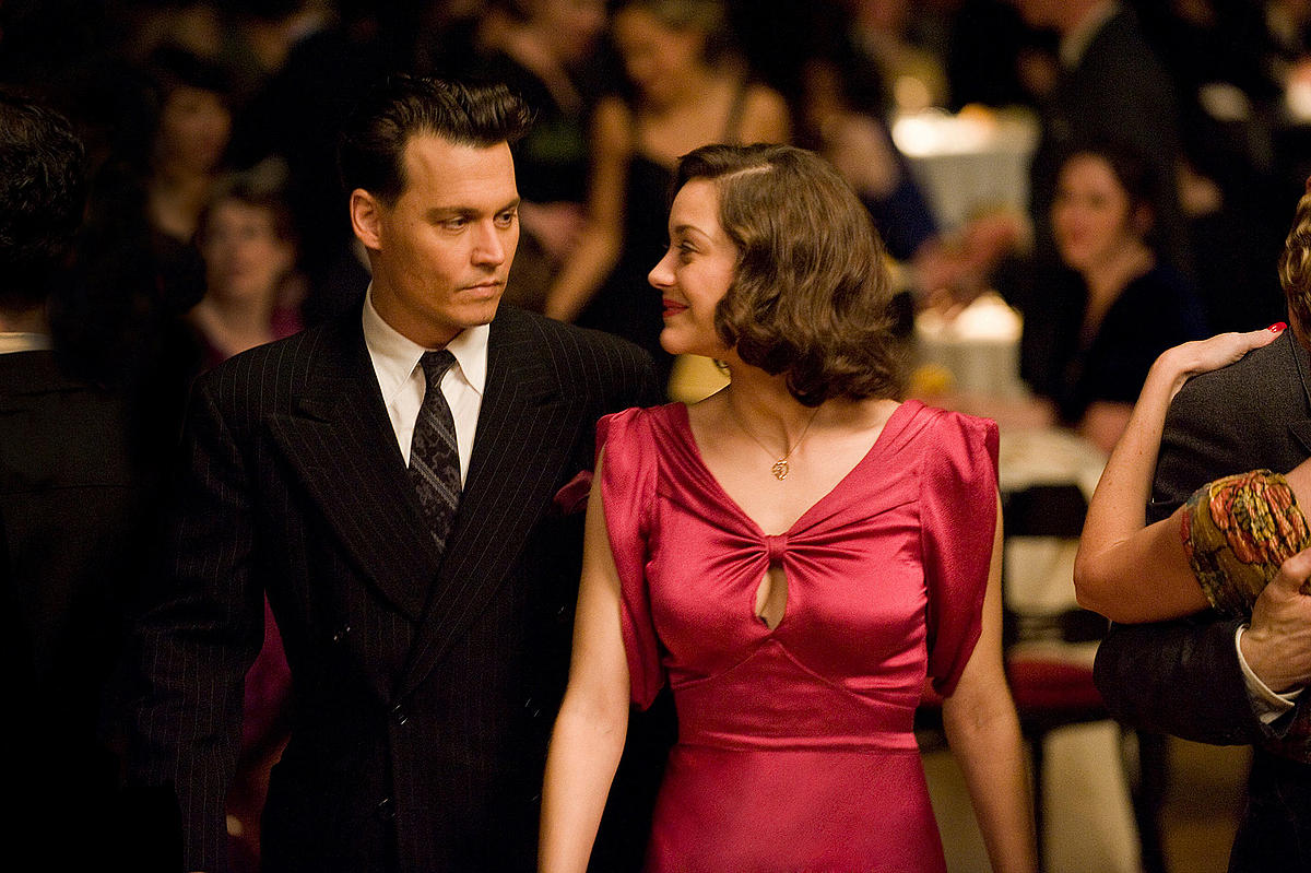 Johnny Depp as legendary Depression-era outlaw John Dillinger and Marion Cotillard as his girlfriend Billie Frechette in 'Public Enemies' (2009)