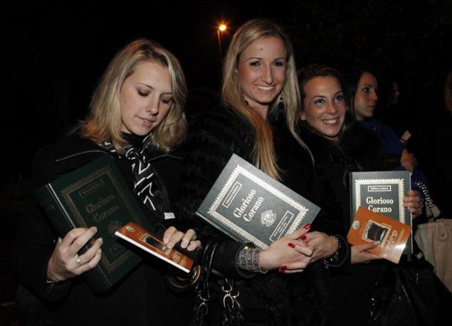 Hundreds of glamorously dressed women, aged between 18 and 35 years old, employed by an Italian modeling agency and taken to the Libyan Ambassadors residence, just to find the Libyan leader Muammar Al-Qaddaf giving each of them a copy of the Quran and enticing them to convert to Islam, Rome, November 15, 2009.