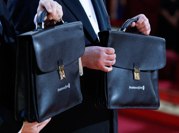 Price Waterhouse accountants carry briefcases filled with the names of the winners at the 82nd Annual Academy Awards, Kodak Theatre, Hollywood, California, March 7, 2010.