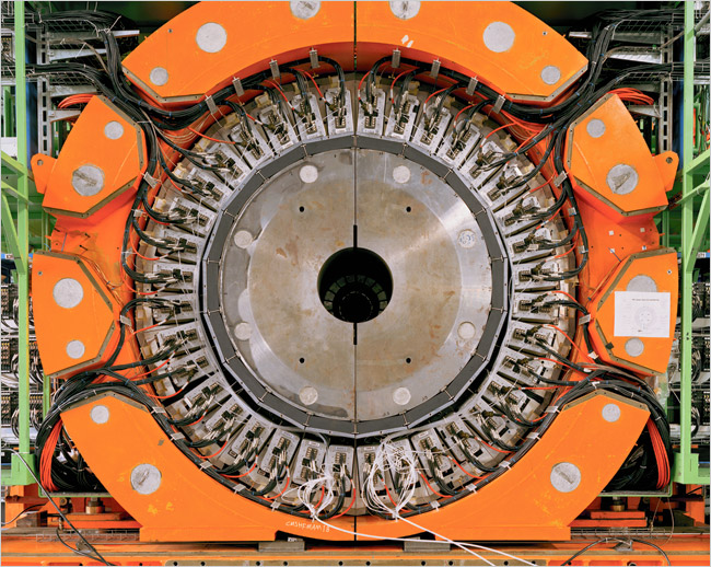 A beam tube carrying protons to be inserted into the hole in the center of the shown section of a particle detector, the five-story building height Compact Muon Solenoid, in the Large Hadron Collider (LHC), the world's largest and highest-energy particle accelerator, intended to collide opposing particle beams of either protons at an energy of 7 teraelectronvolts (1.12 microjoules) per particle, The European Organization for Nuclear Research (CERN), near Geneva, Switzerland, late 2006.