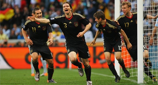 Germany's Arne Friedrich (2L) celebrates scoring the third goal with teammates Miroslav Klose (L), Thomas Mueller (2R) and Per Mertesacker (R), during the 2010 FIFA World Cup Quarter Final match in which Germany smashed Argentina 4-0, Green Point Stadium, Cape Town, South Africa, July 3, 2010.