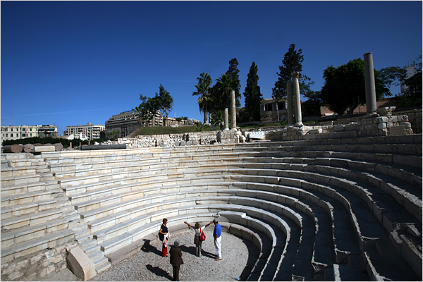 A tourist checks out the acoustics inside of the Roman Amphitheater in the city of the legendary building, Alexandria, Egypt, December 2007.