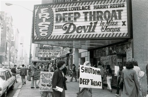 Women protest outside a Times Square area theater showing the sexually explicit film Deep Throat, c. 1970.
