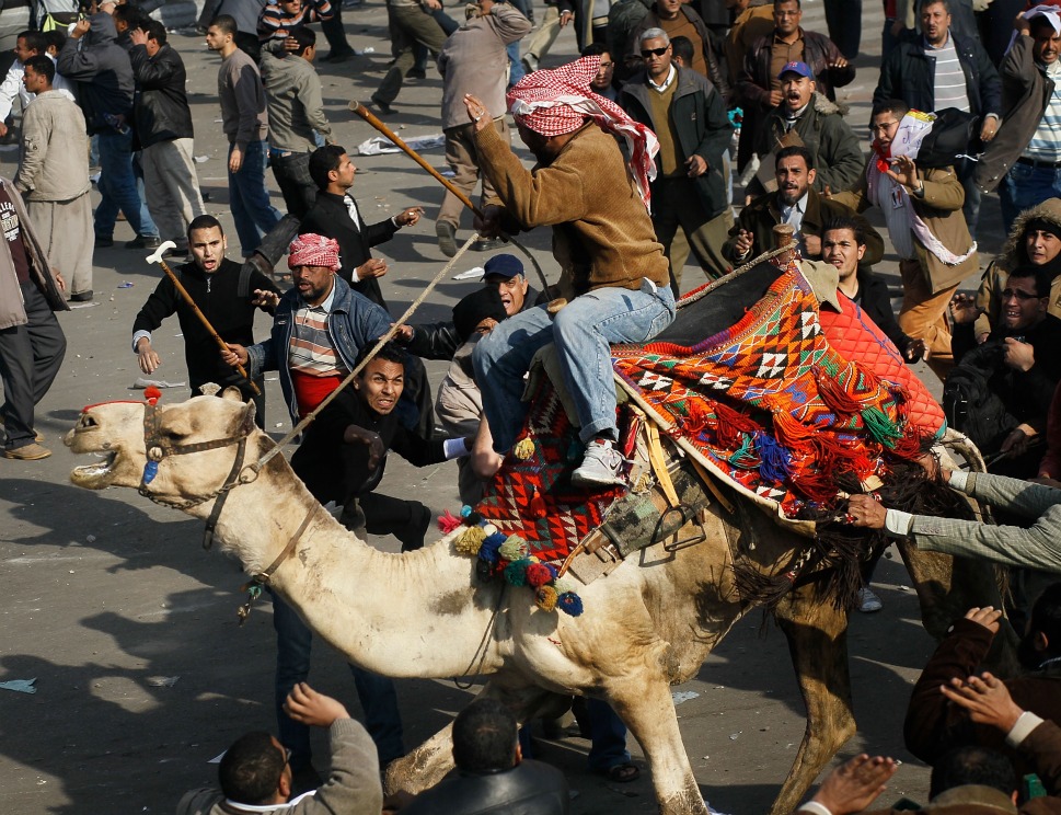 Some of pro-Egypt millions, at one point ride horses and camels through A-Tahrir Square in an attempt to disperse the protesters, downtown Cairo, Egypt, February 2, 2011.