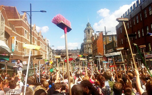 People gather in Clapham, determiend to undo the damage that was done the night before, London, August 9, 2011.