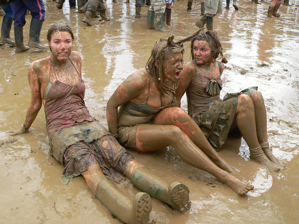 Glastonbury Festival goers enjoy the mud, June 2009.