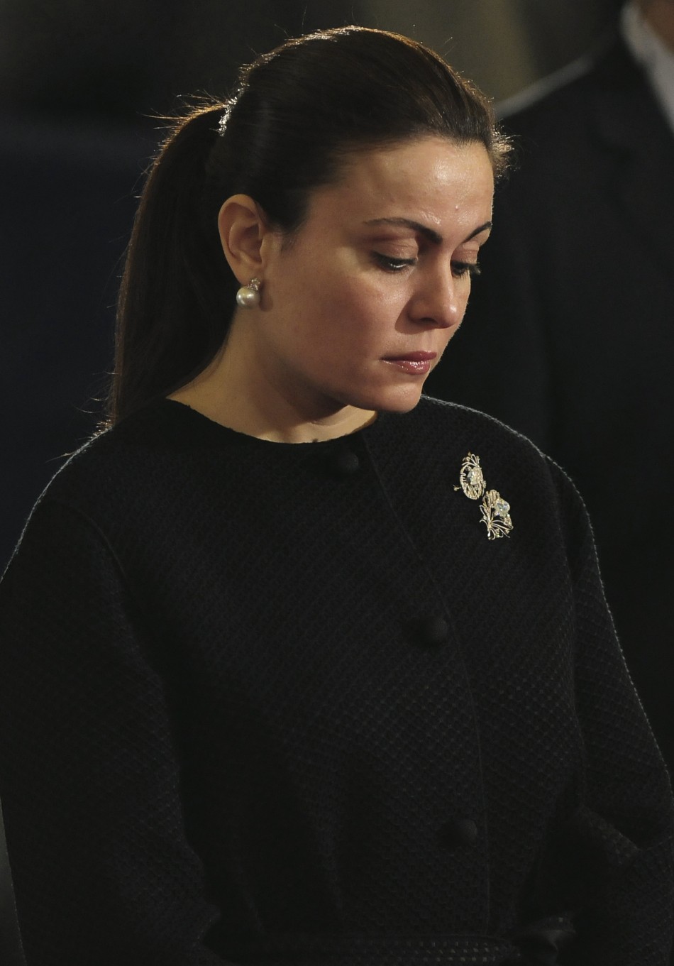 Heddy Rasekh, wife of Alaa Mubarak, attends the Coptic Christmas eve mass, led by Pope Shenouda III, the 117th Pope of the Coptic Orthodox Church of Alexandria and Patriarch of the See of St. Mark, Greater St. Mark Cathedral, Cairo, January 6, 2011.