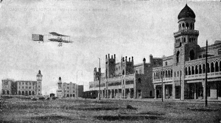 Postcard depicting Downtown Heliopolis, Cairo, Egypt, with Heliopolis Oases Company offices above arcaded round floor and an Airplane flying above during 1910 Air Show.