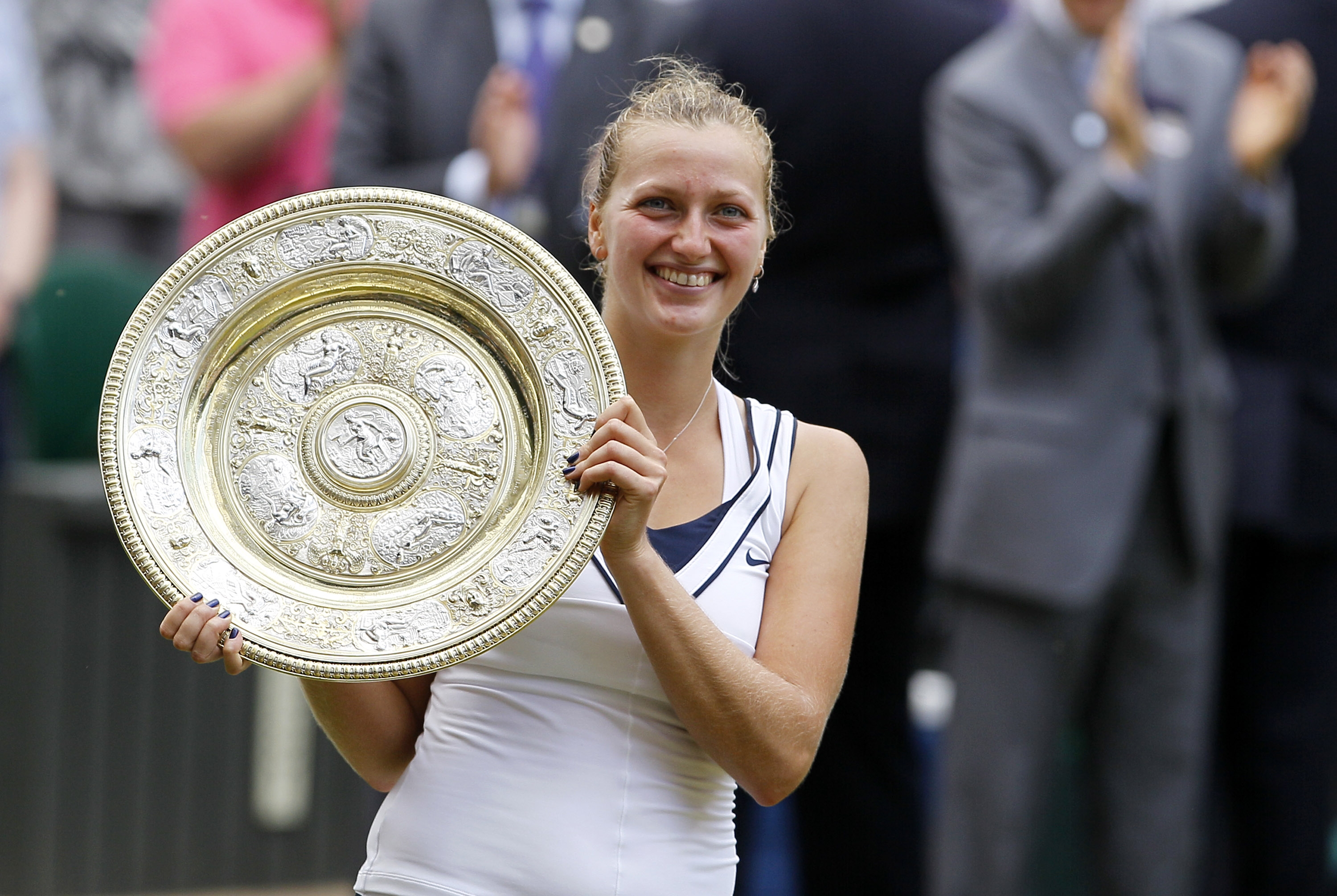 Czech Republic's Petra Kvitova holds the Ladies winning trophy after beating Maria Sharapova of Russia in the Women's Final of the 125th Wimbledon Championships at the All England Lawn Tennis Championships at Wimbledon, London, July 2, 2011.