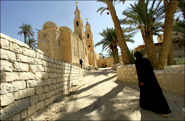 A Coptic monk walks through St. Anthony's Monastery which is generally considered to be the birthplace of the Christian monastic movement, Zafarana, Egypt, September 2005.