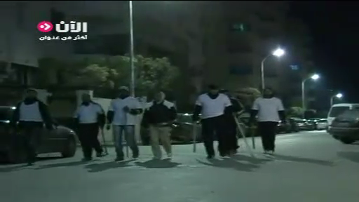 Middle-class men with sticks on night watch to protect their neighborhoods against looting as riots forced President Zein al-Abedeen bin Ali to flee into exile, Tunis, Tunisia, January 14, 2011.