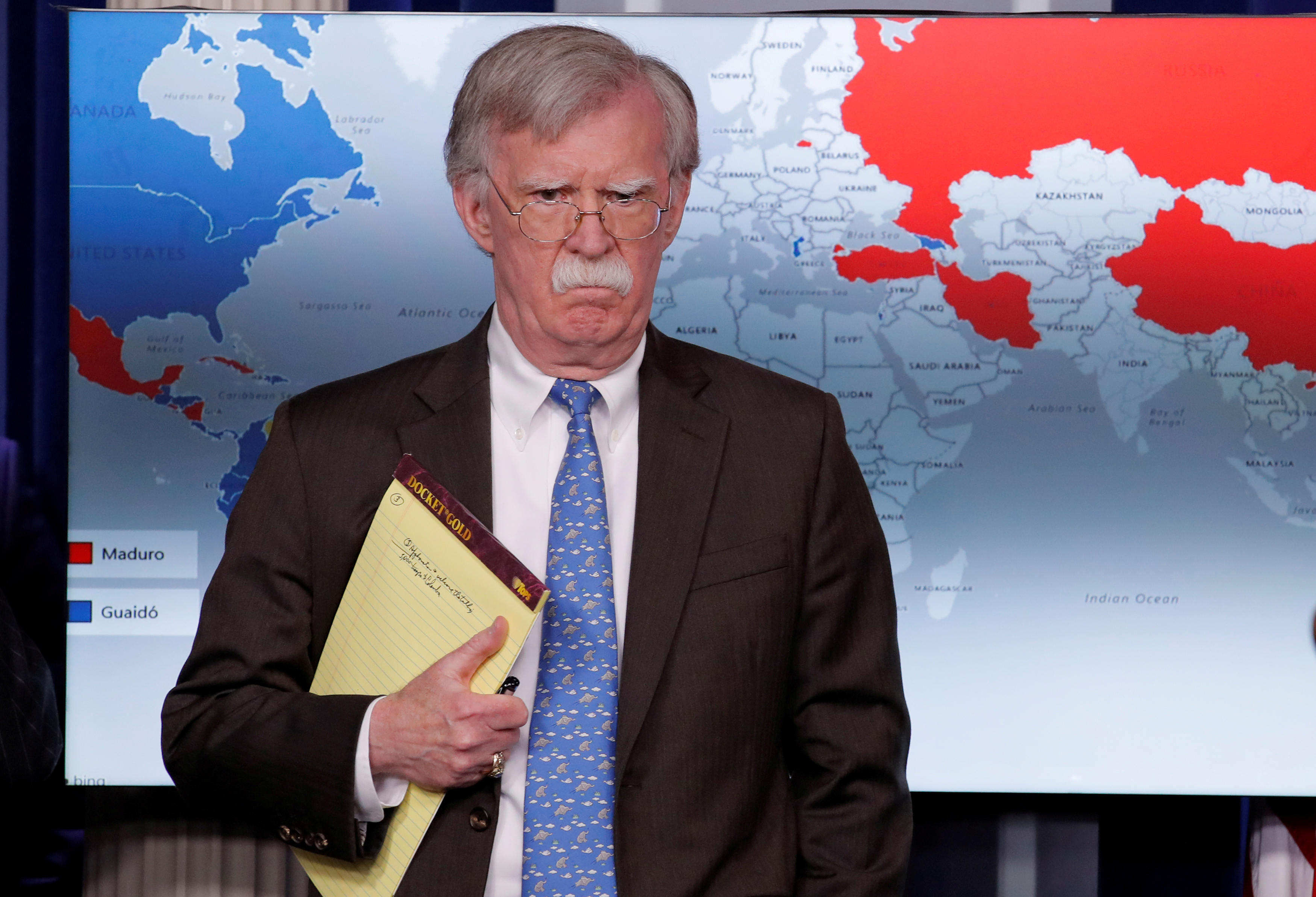 Holding a notepad with the words 5,000 troops to Colombia, U.S. National Security Adviser John Bolton arrives to address reporters as the Trump administration announces economic sanctions against Venezuela and the Venezuelan state-owned oil company Petroleos de Venezuela (PdVSA), Washington, January 28, 2019. 