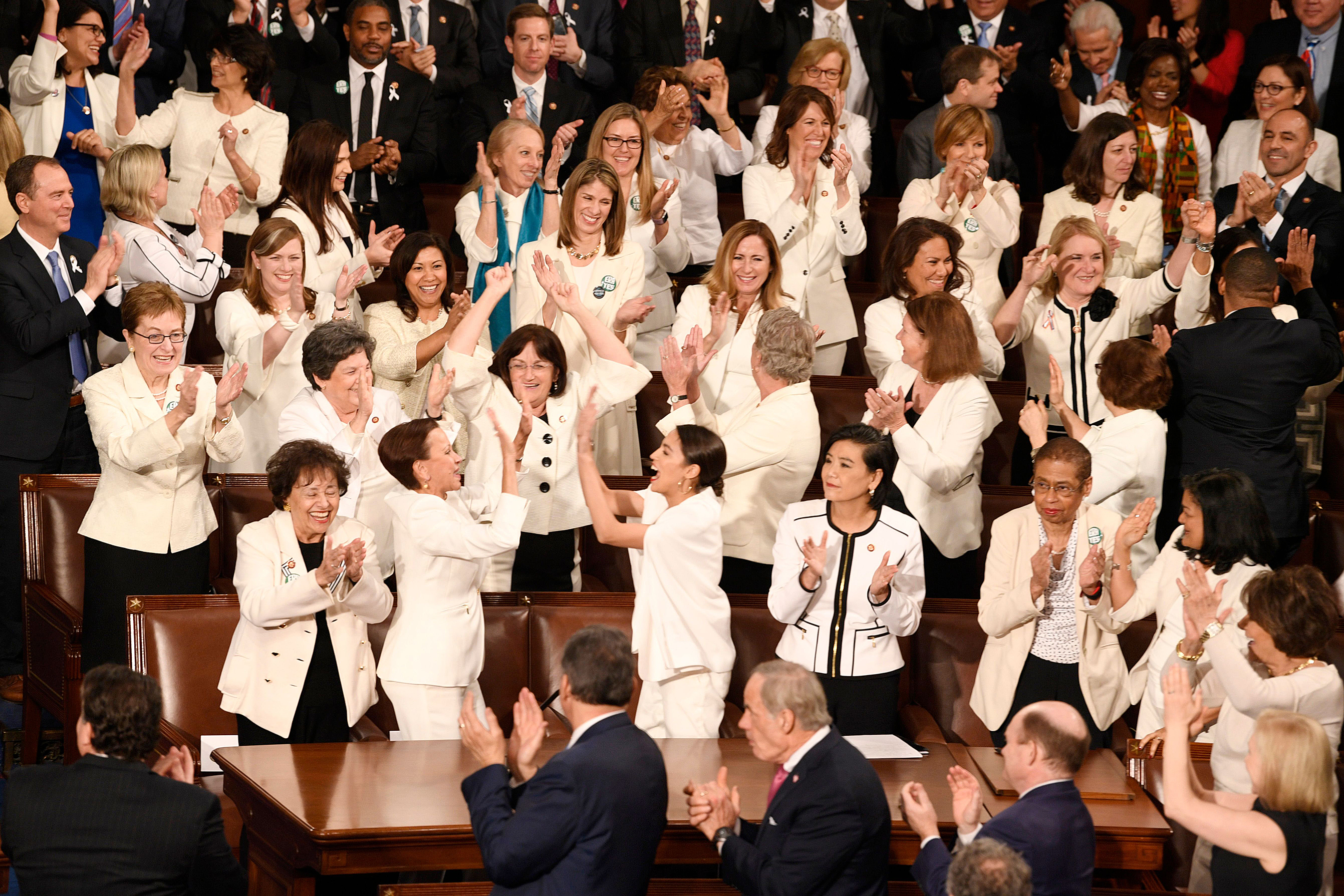 Congresswomen wearing white color meant to honor the women’s suffrage movement that led to the ratification of the 19th Amendment in 1920, are recognized by President Donald Trump as he delivers the State of the Union address, Washington, February 5, 2019.